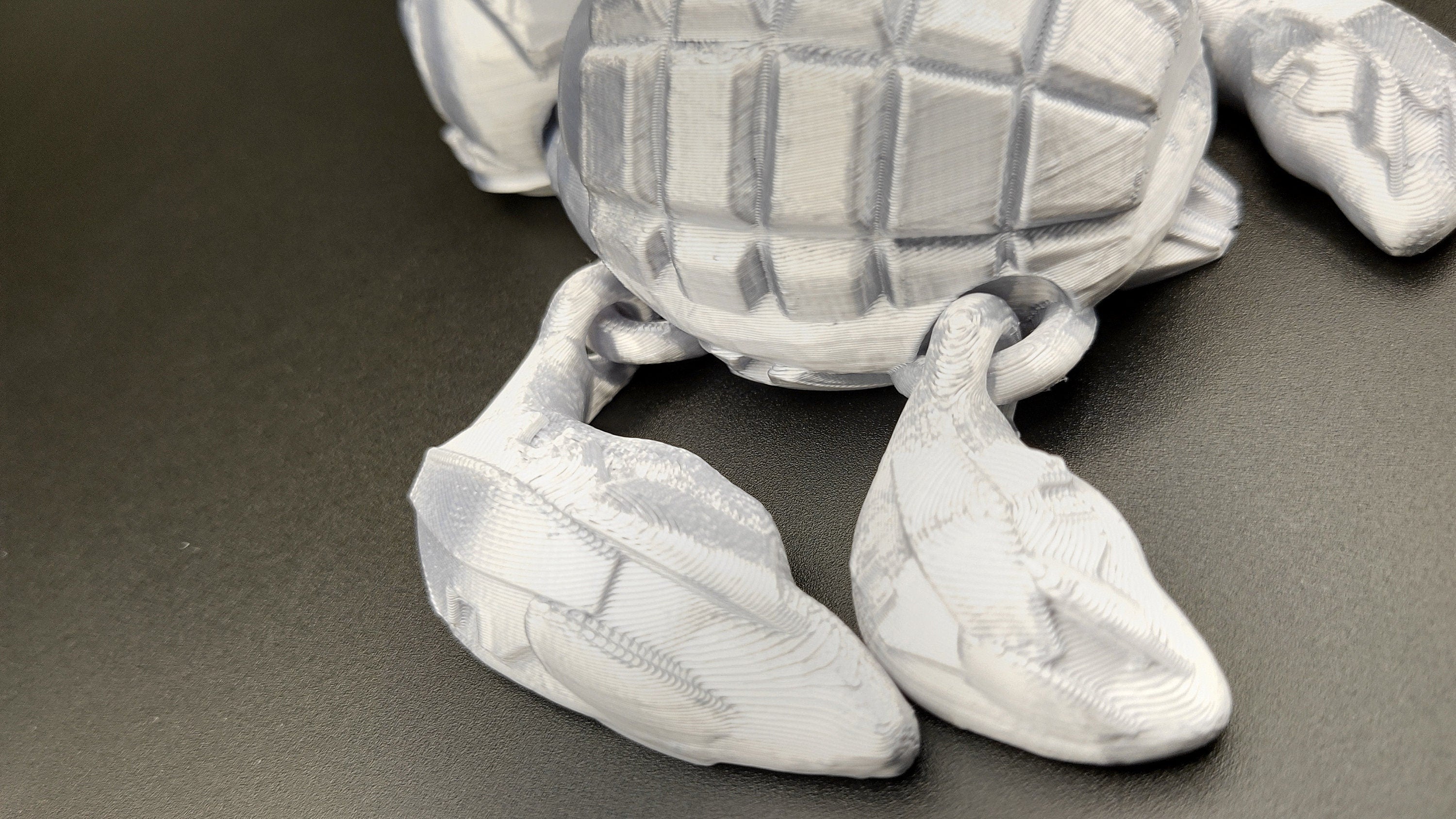 Silver Color Grenurtle, grenade / turtle 3d printed (made) adult desk fidget toy. Sensory turtle buddy.