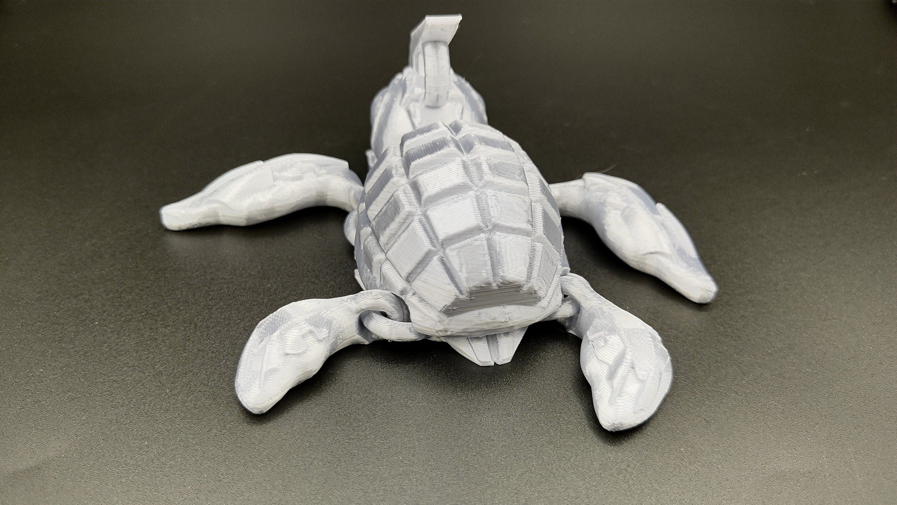 Silver Color Grenurtle, grenade / turtle 3d printed (made) adult desk fidget toy. Sensory turtle buddy.