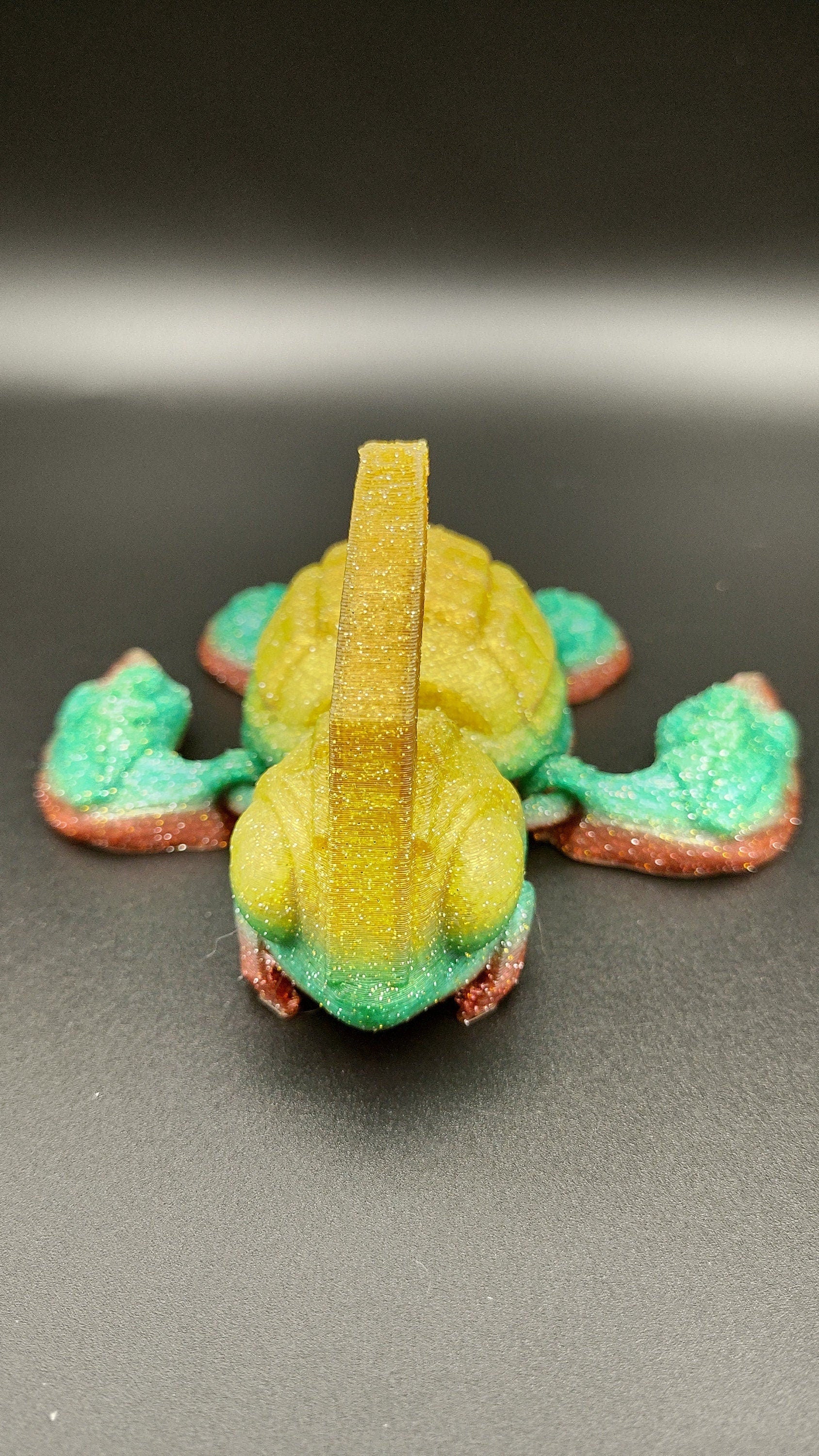 Sparkle Rainbow, (Red, Green, Yellow Gold,) Grenurtle, grenade / turtle 3d printed (made) adult desk fidget toy. Sensory turtle buddy.