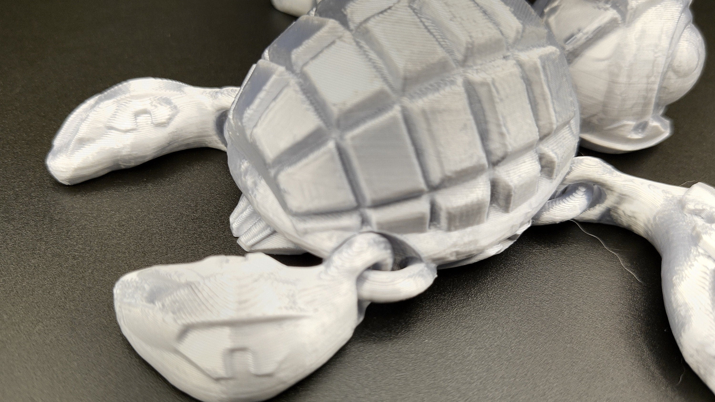 Silver Color Grenurtle, grenade / turtle 3d printed (made) adult desk fidget toy. Sensory turtle buddy.