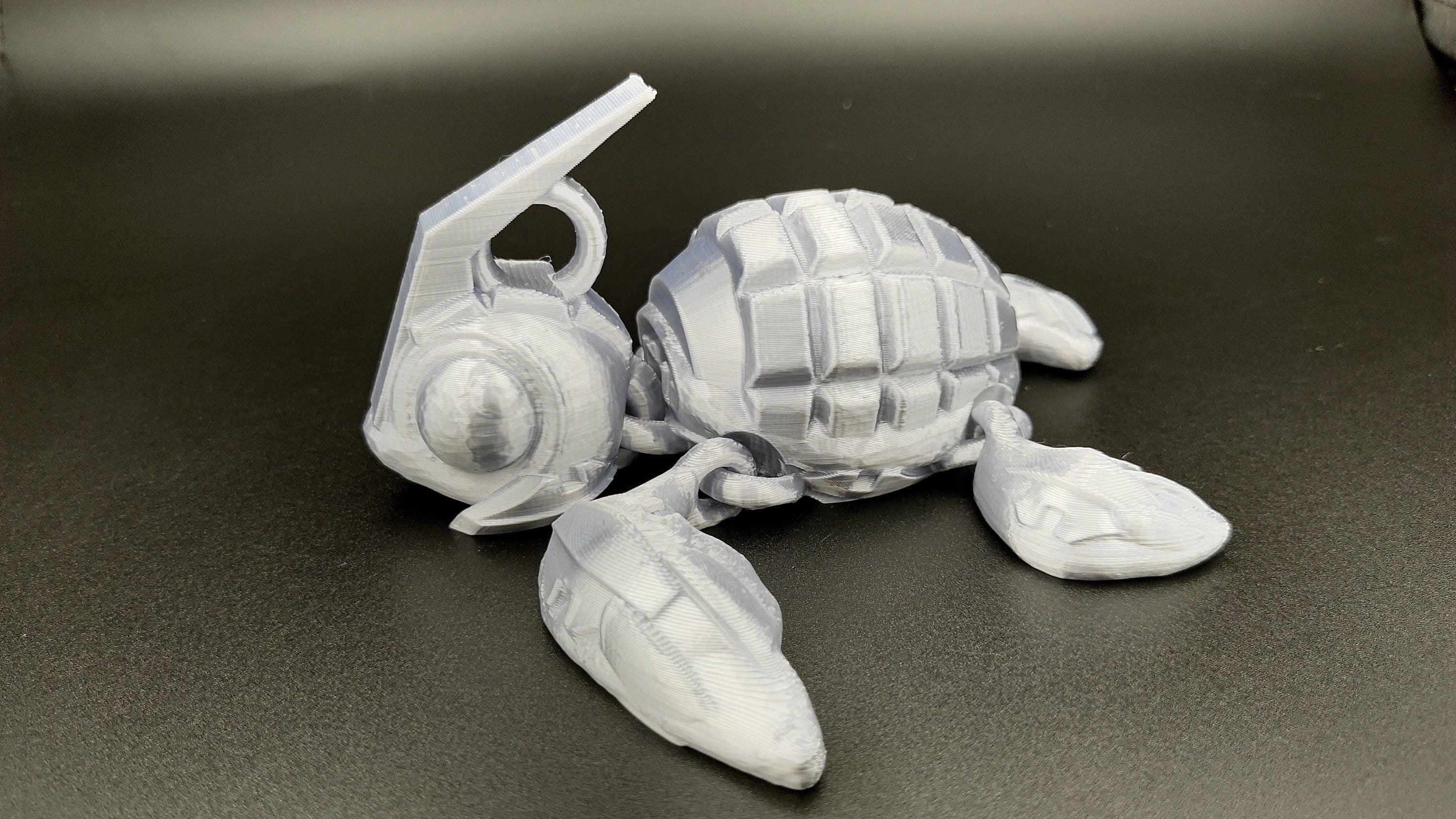 Silver Color Grenurtle, grenade / turtle 3d printed (made) adult desk fidget toy. Sensory turtle buddy.